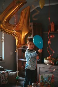A cheerful and simple kids birthday party at hoA cheerful and simple kids birthday party at home with balloons and a celebration cakeme with balloons and a celebration cake